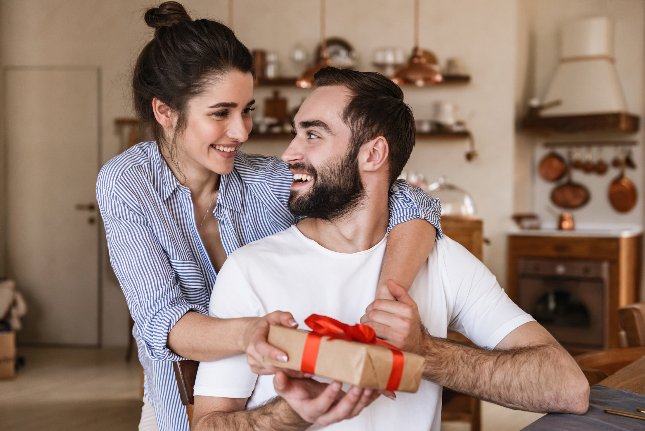 Happy Couple Holding a Present